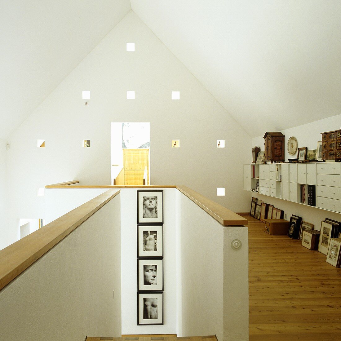 A house with an open stairway and a gallery with a view on a gable wall