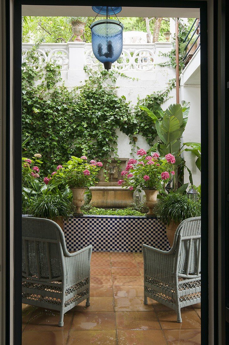 View into the green oasis of a Mediterranean patio
