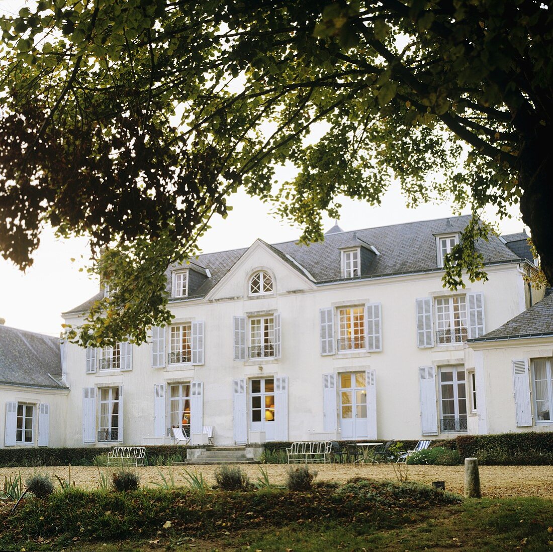 A manor house in France with sorry-looking garden