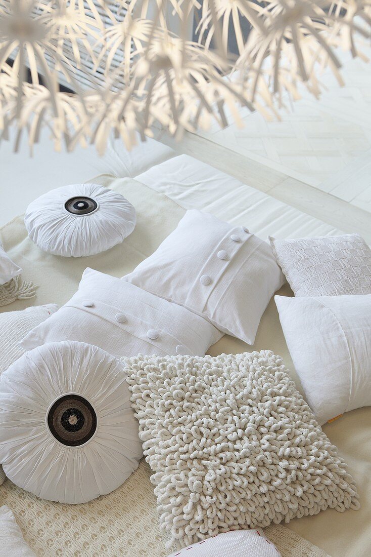 Various white cushions