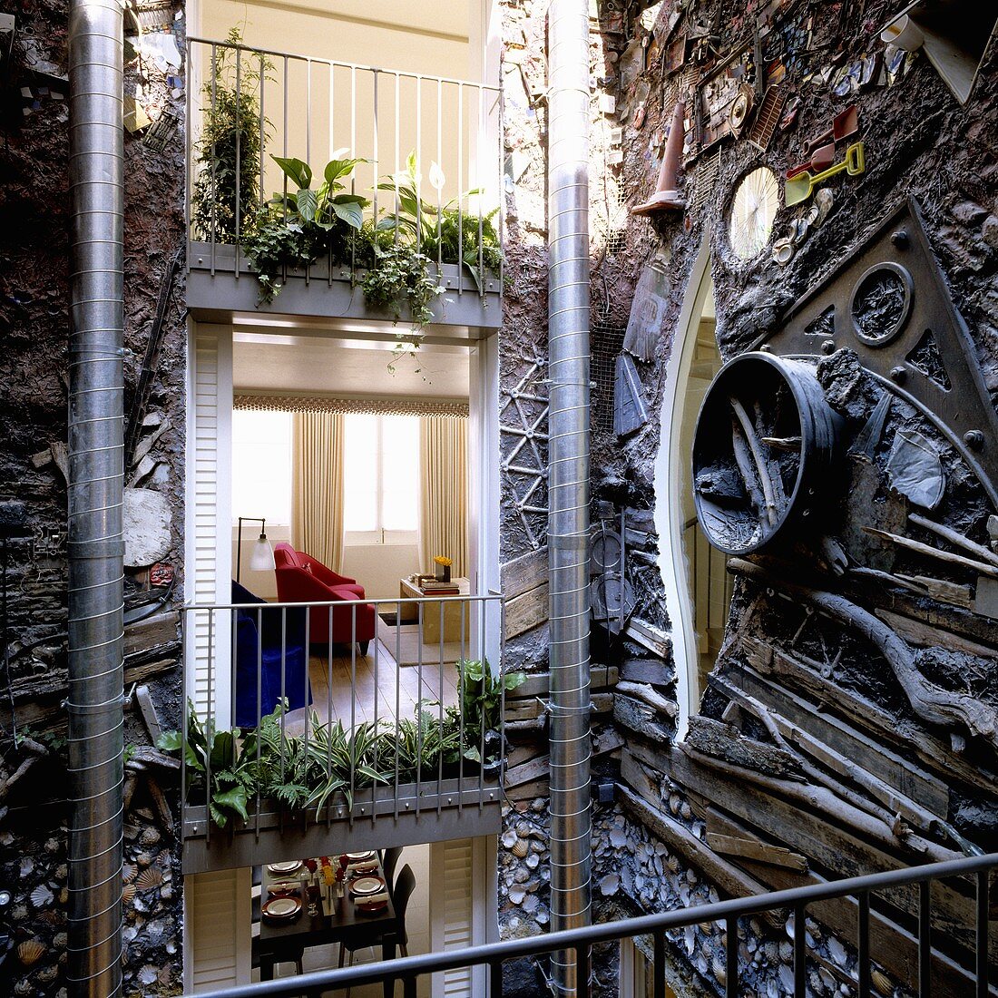 An artistically designed courtyard facade with a view into an apartment