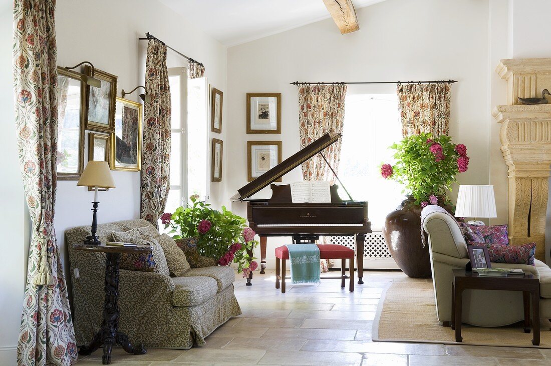 A Mediterranean living room with sofas and a piano