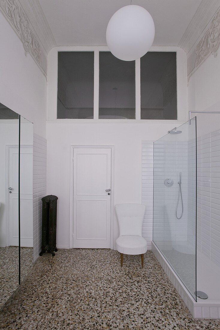 Art nouveau bathroom with a terrazzo floor and a designer shower