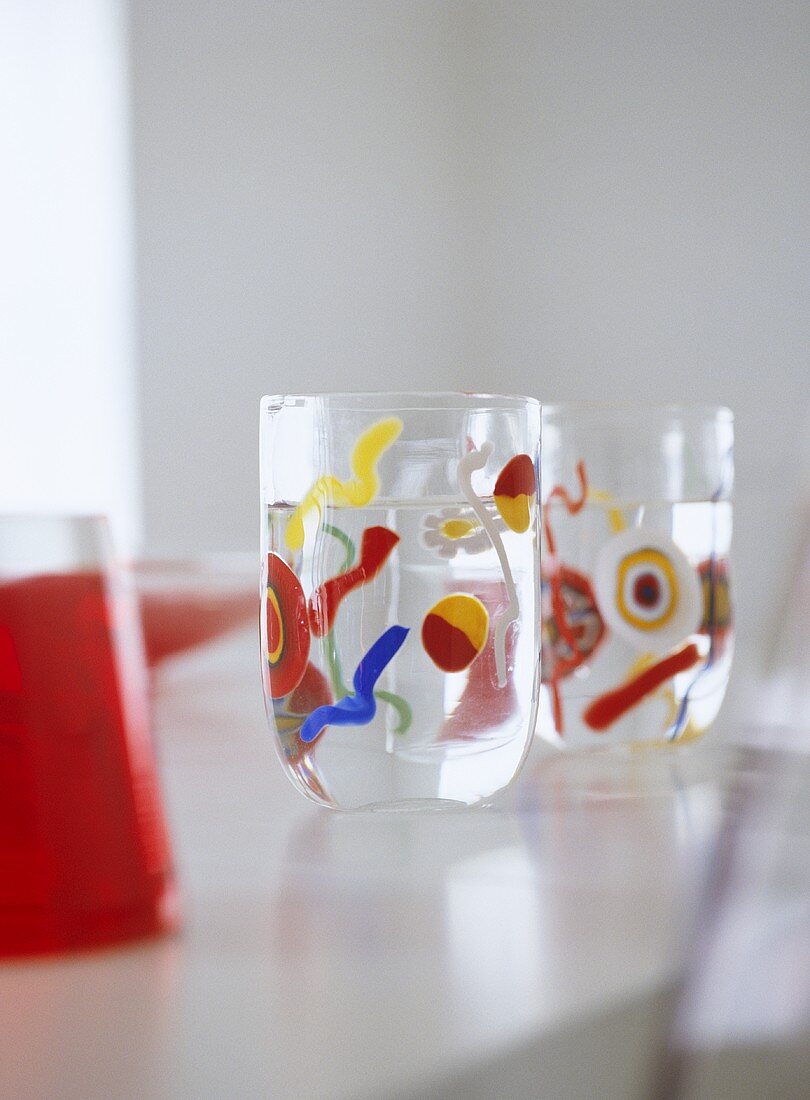 Close up of patterned glasses on dining room table.