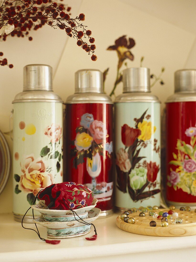Collection of thermos flasks with floral pattern