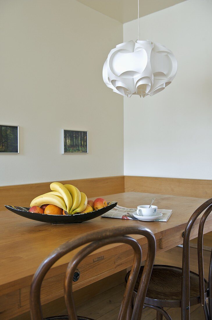 Pendant light above wooden table in modern dining room
