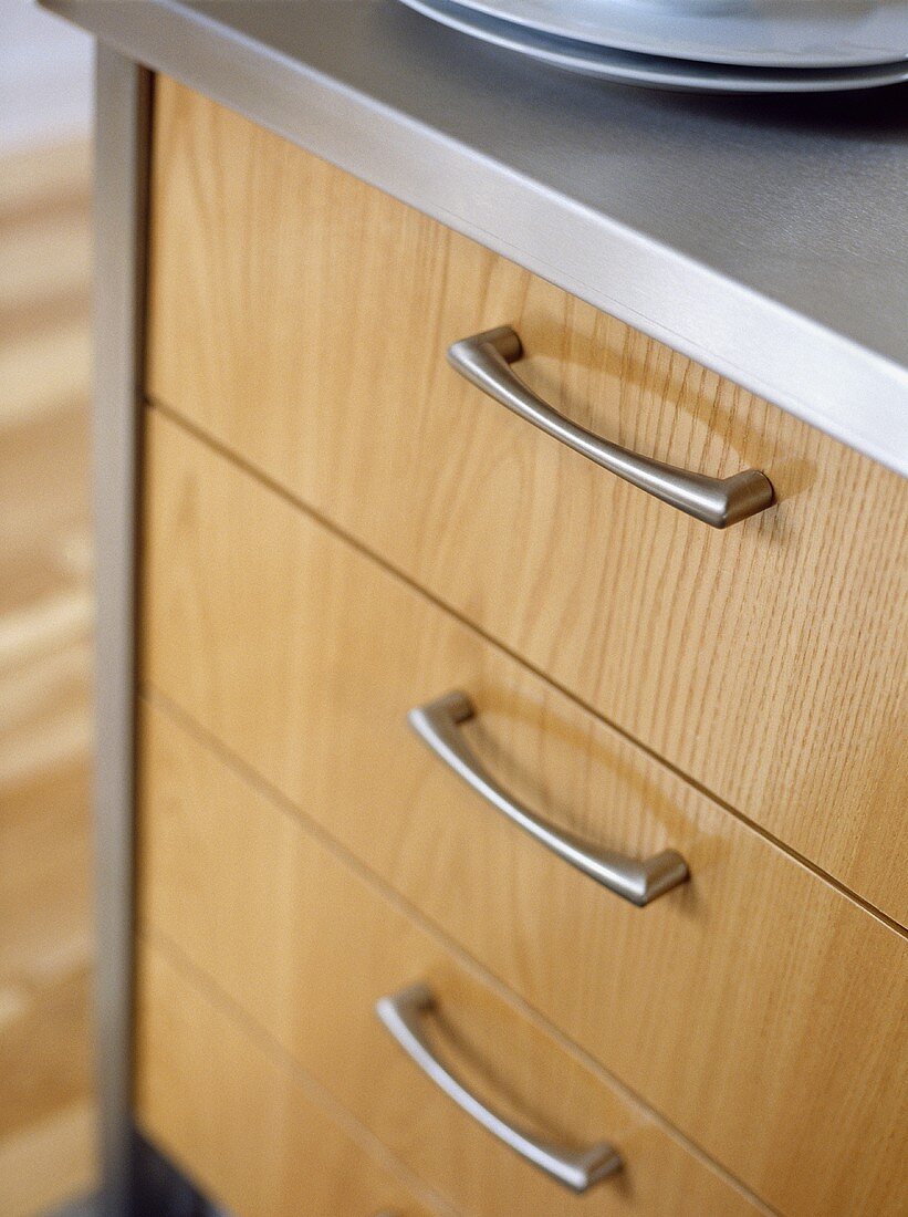 Close up of kitchen unit with wooden drawers