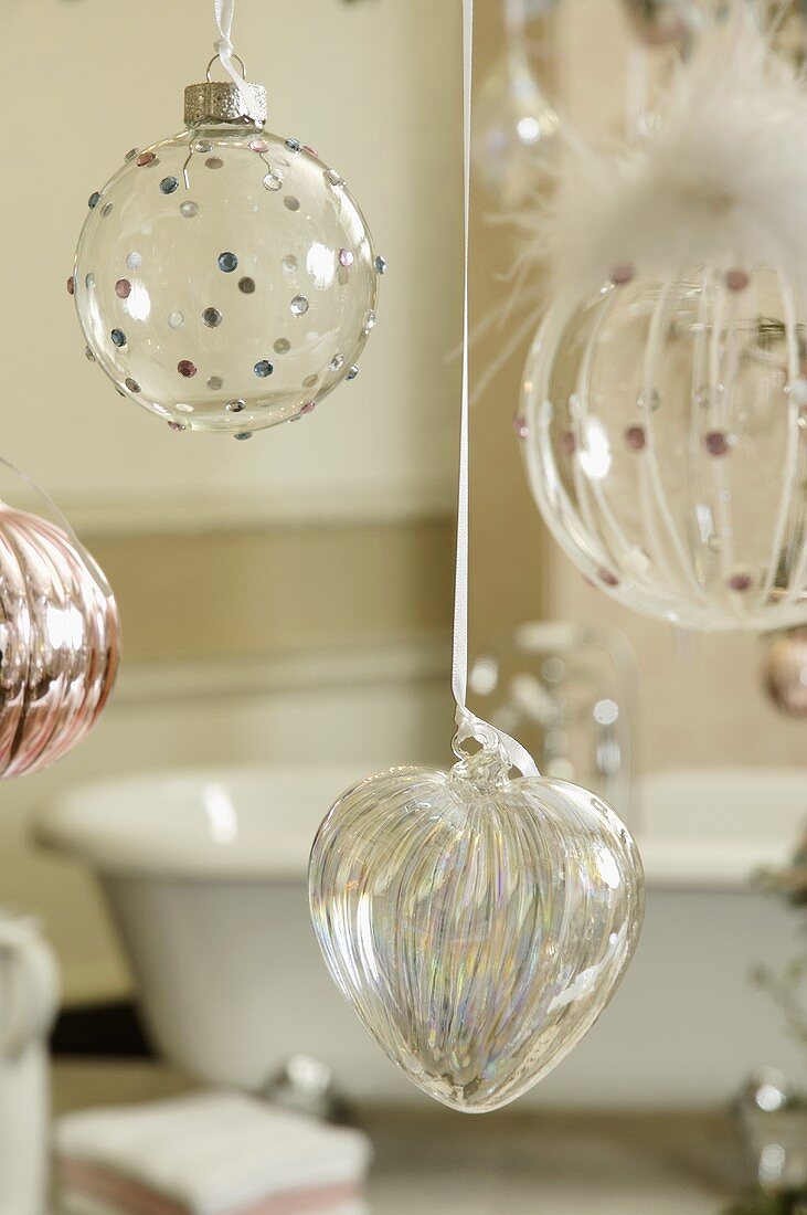 Hanging transparent Christmas ball ornaments and glass heart