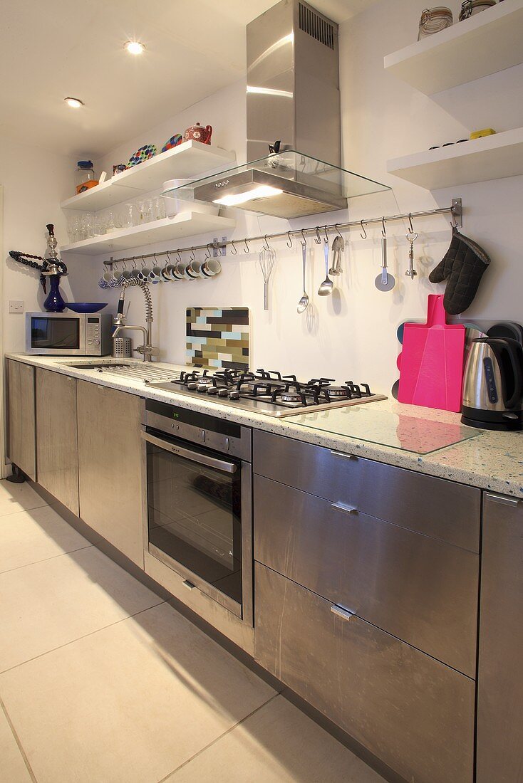 A kitchen with stainless steel cupboards