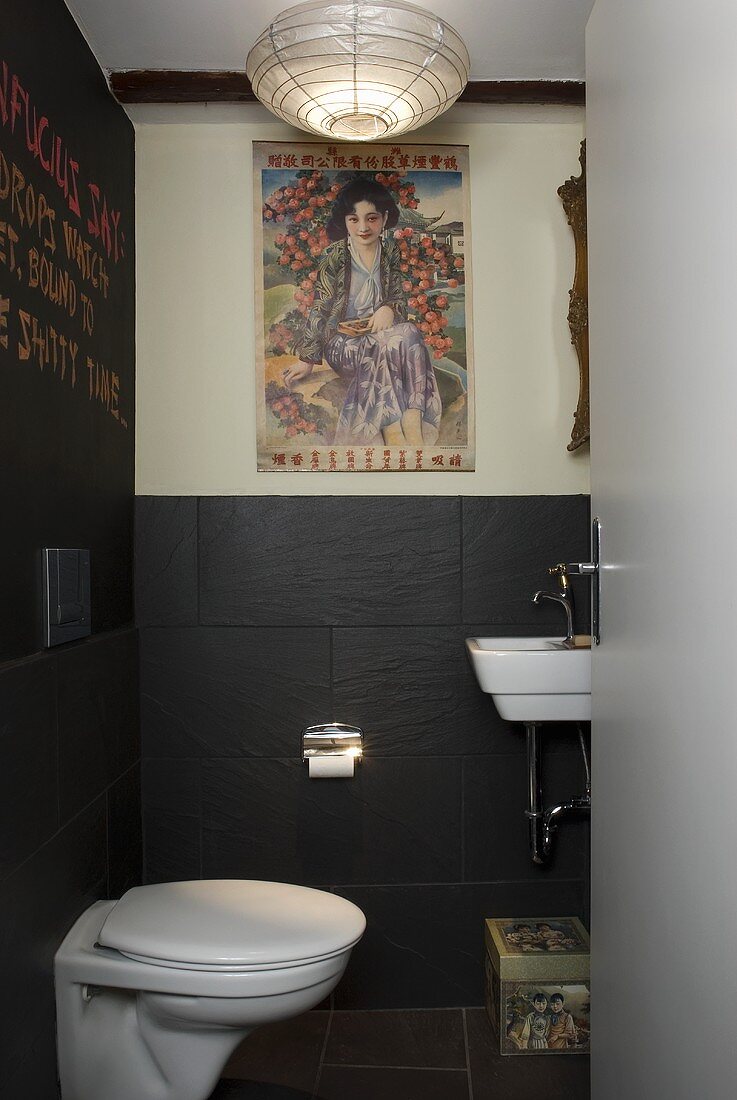 A designer toilet with grey slate wall tiles