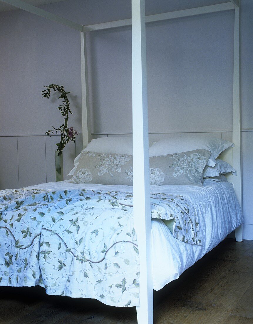 A four poster bed in a bedroom in a country house