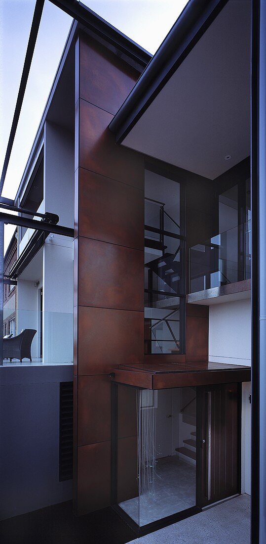 A spacious anteroom in a modern, newly built house with a view of a stairwell