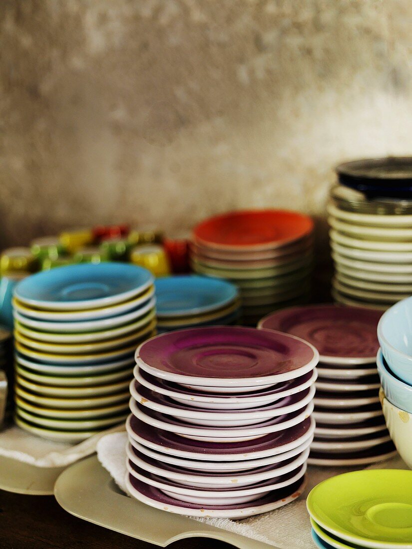 Stacks of different coloured plates