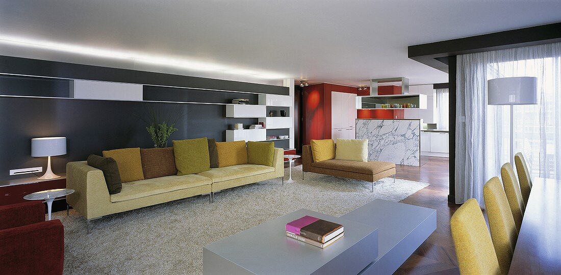 A spacious, open-plan living room with a designer sofa