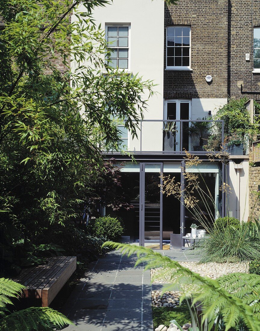 An English house with a modern extension and a garden