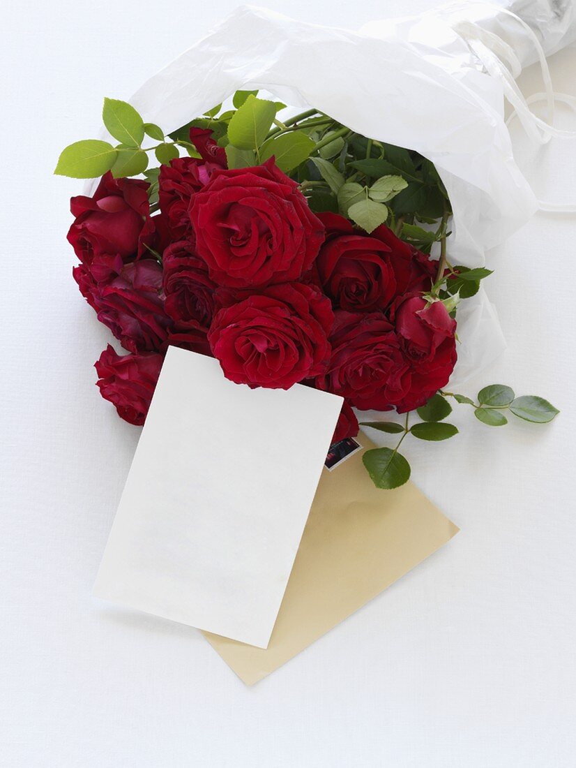 A bouquet of roses with a card