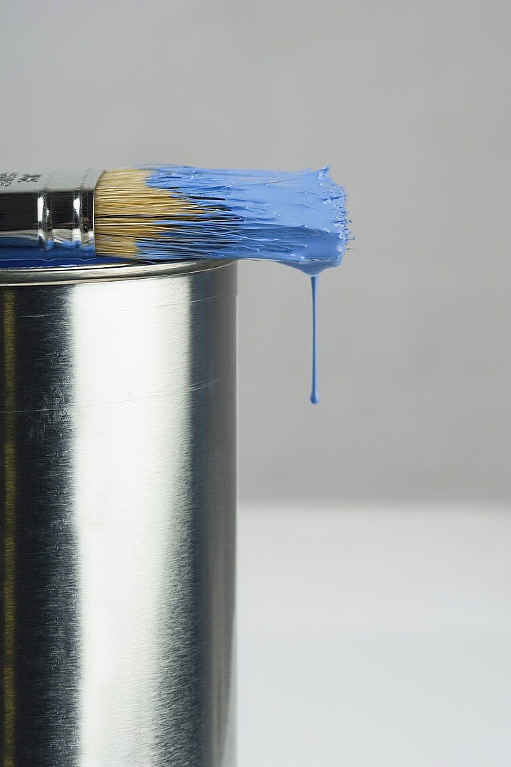 Paint dripping off a paintbrush