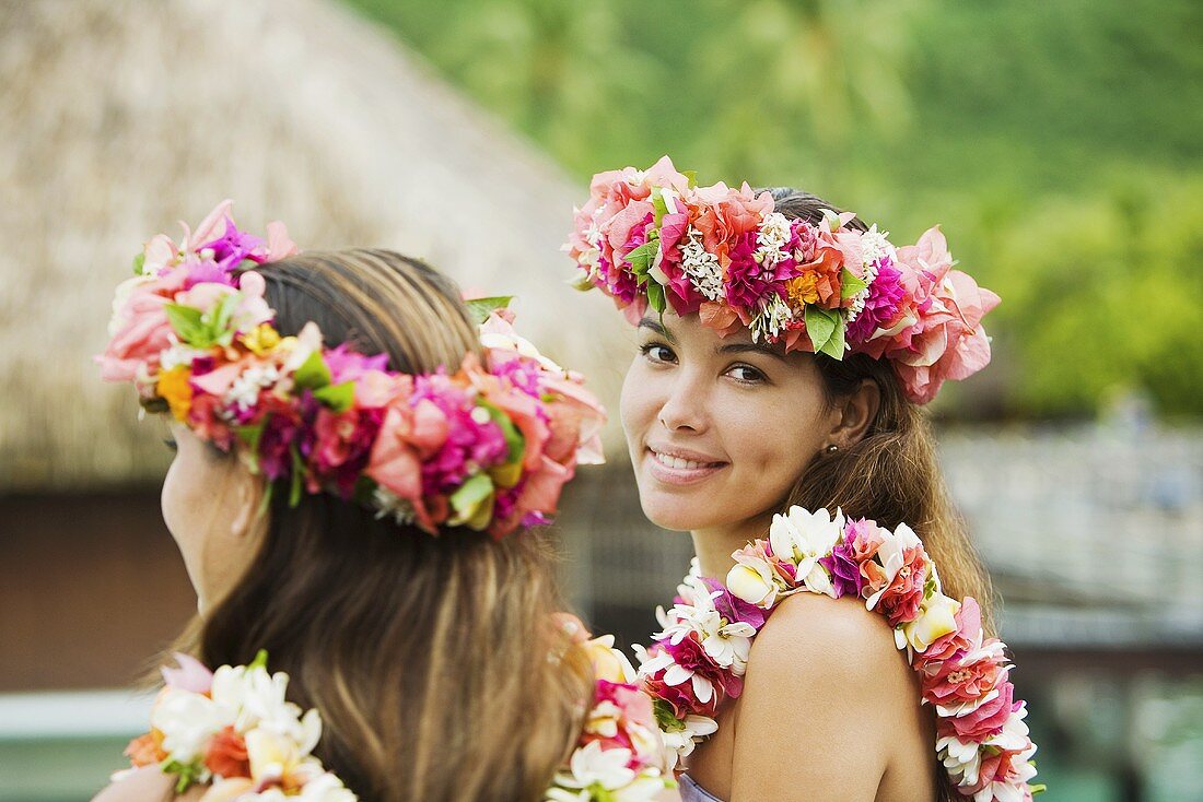 Young women with flowers in hair in moorea