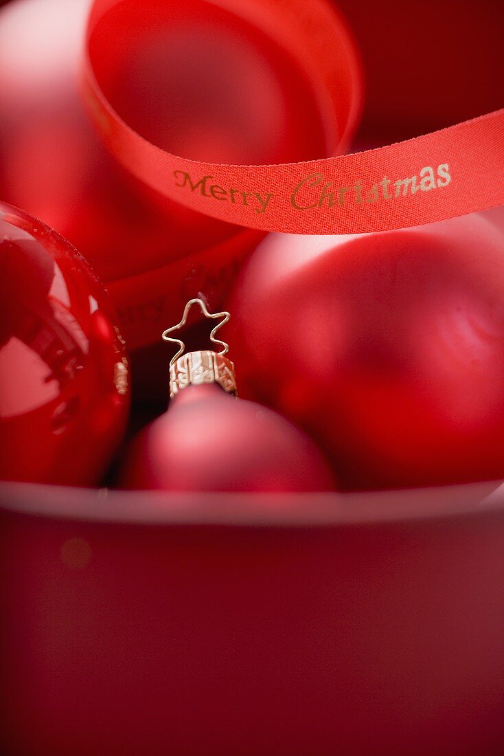 Red Christmas baubles with ribbon