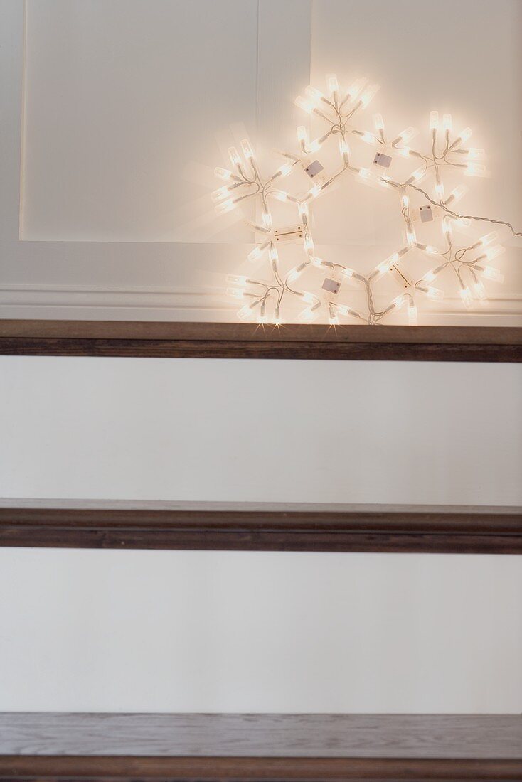 Christmas decoration: illuminated star on stairs