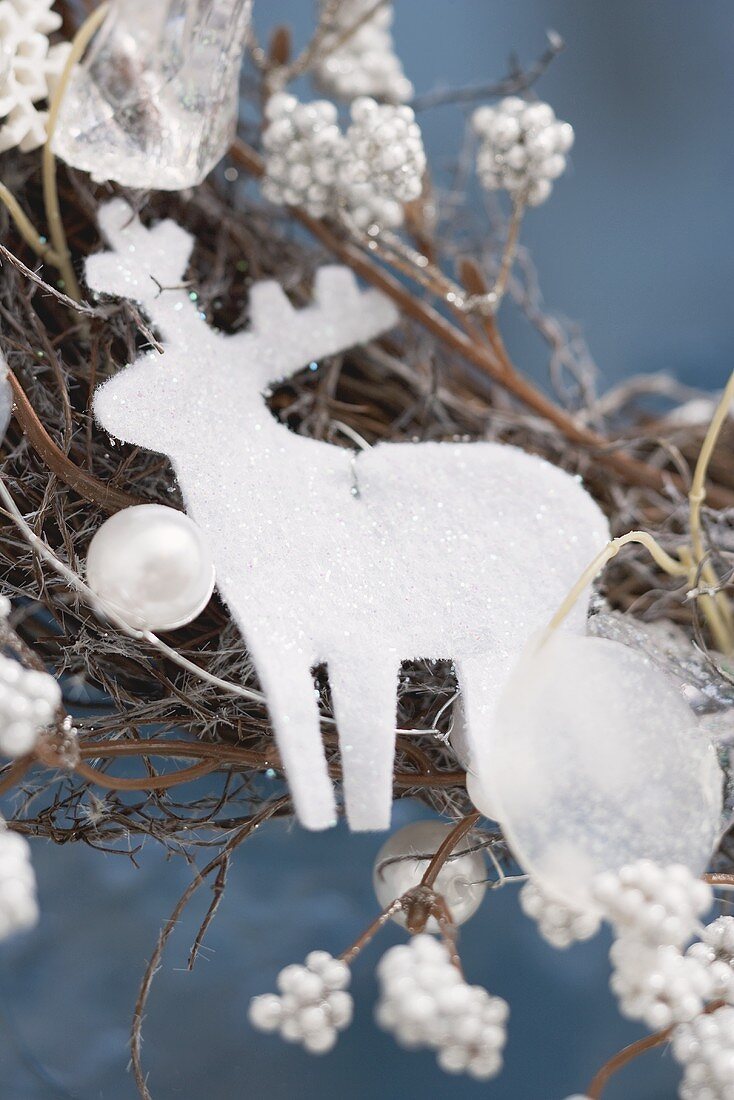 White reindeer on Christmas wreath (close-up)