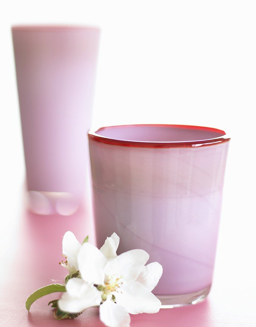 Pink glass vases with apple blossom