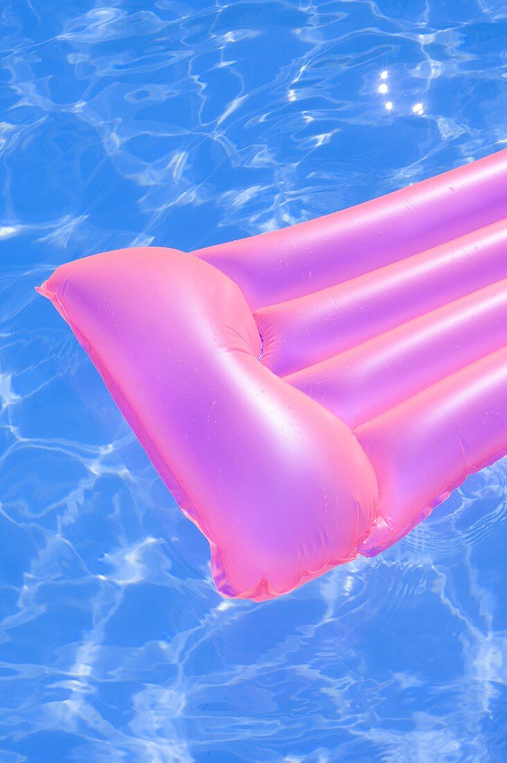 Pink air bed in water