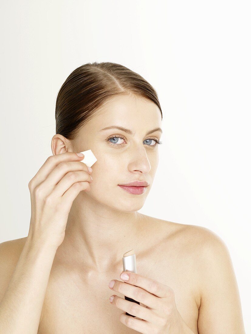 Woman putting on make-up