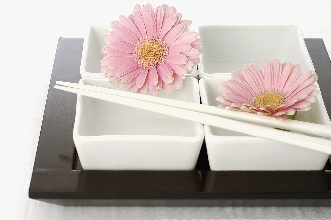 Dishes with chopsticks and flowers (Asia)