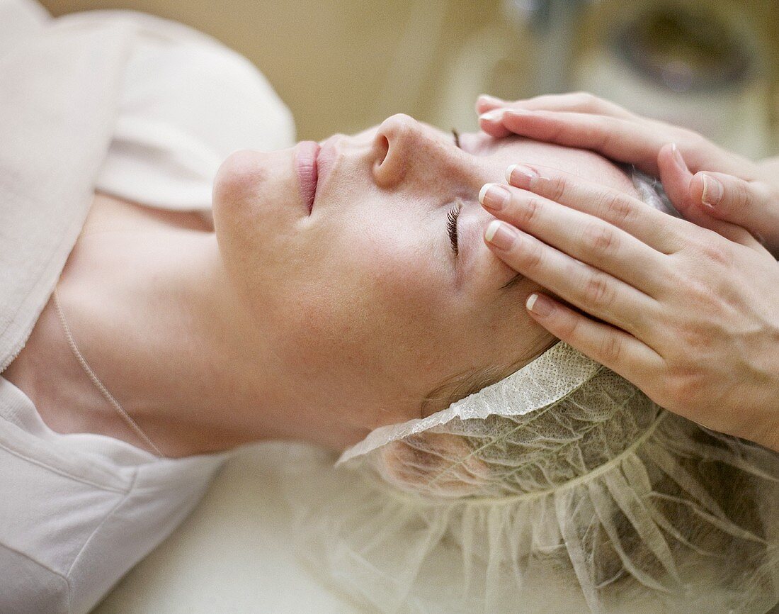 Woman having a face massage