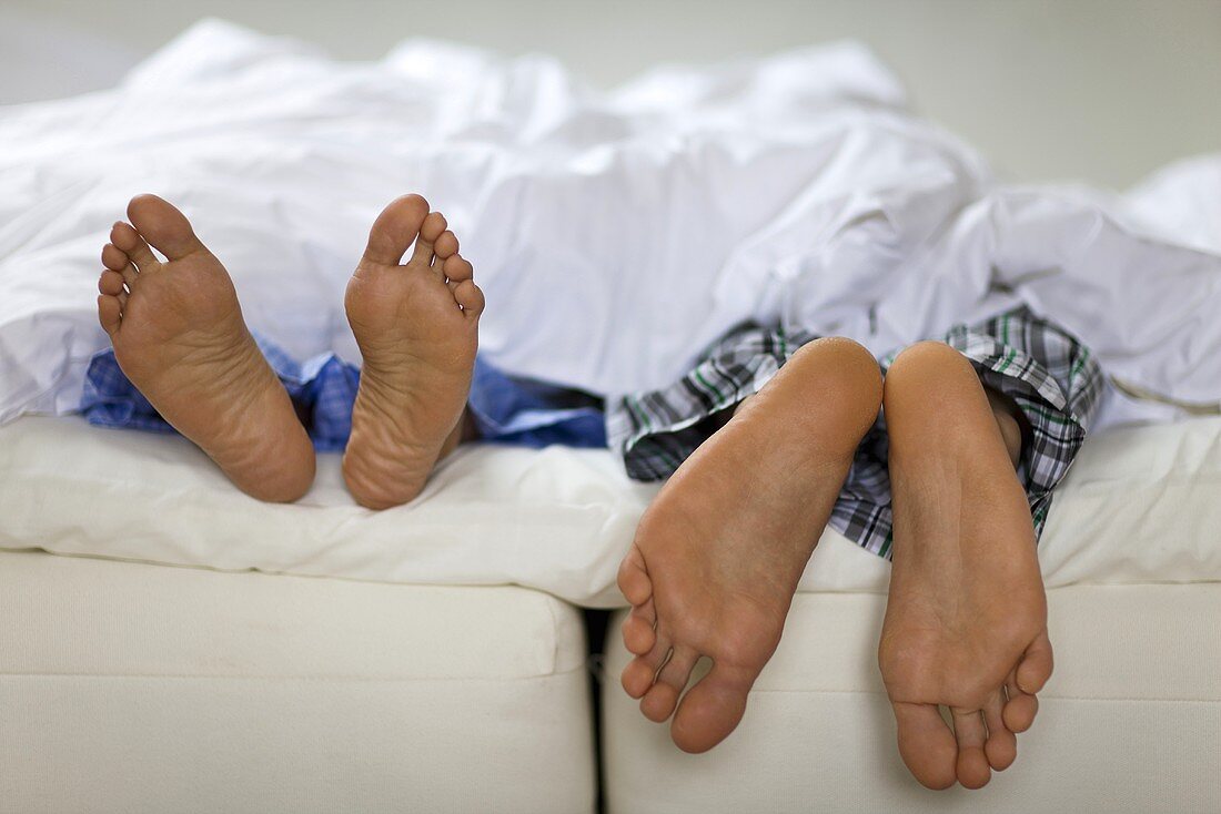 Man and woman lying in bed