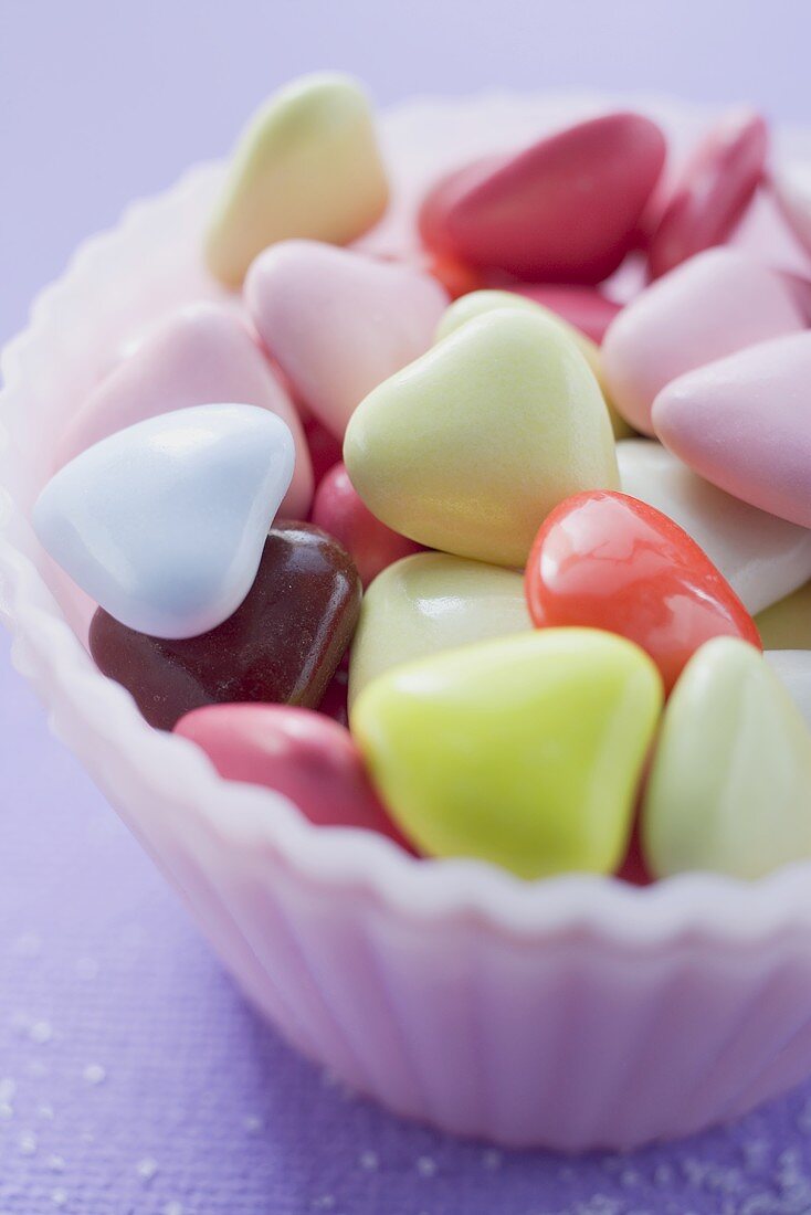 Coloured hearts in small pink dish
