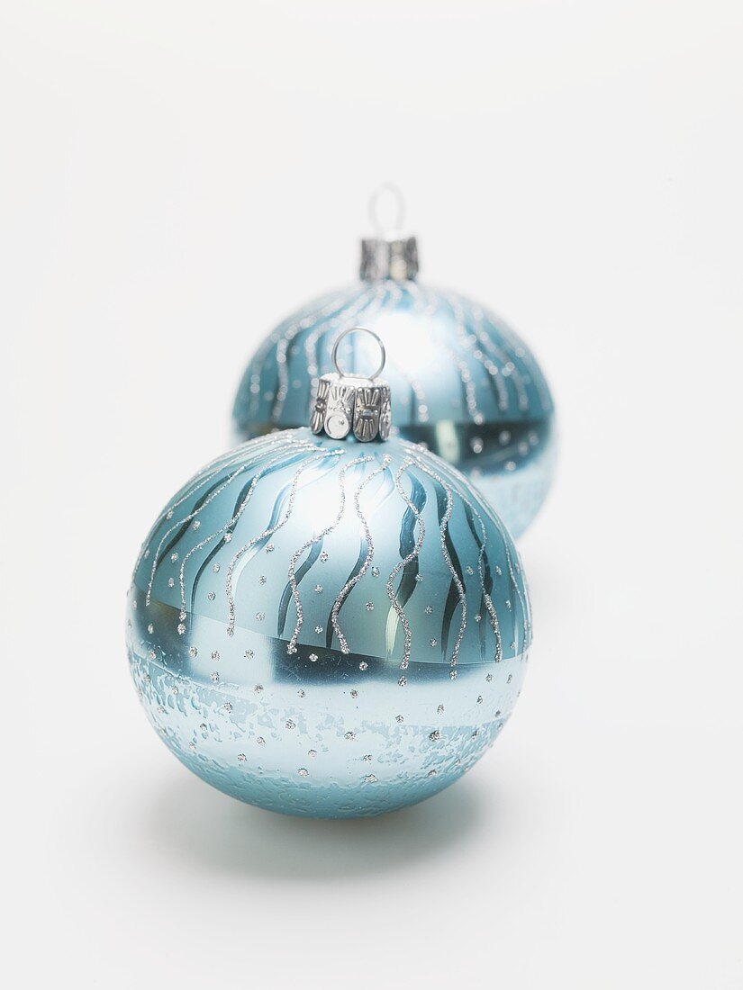 Two turquoise Christmas baubles