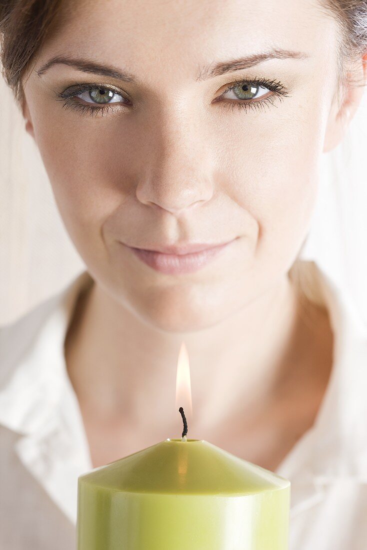 Young woman with a candle