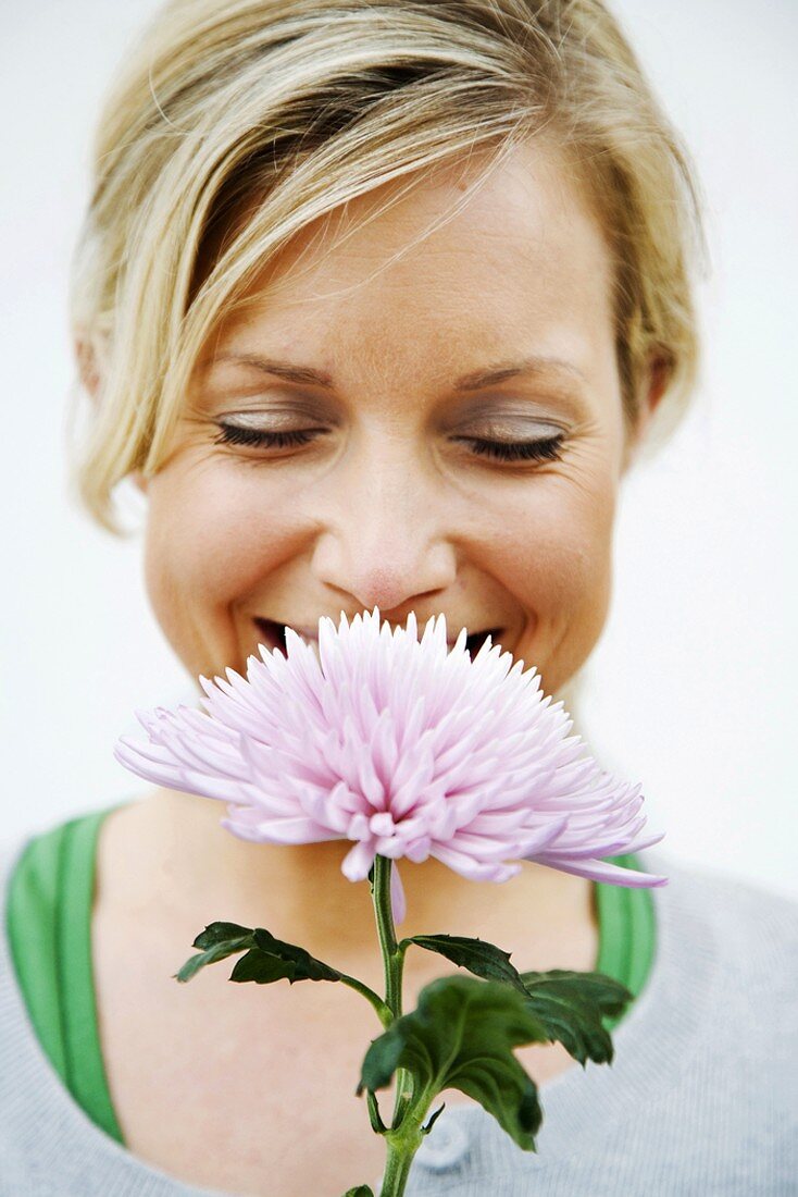 Smiling woman with flower