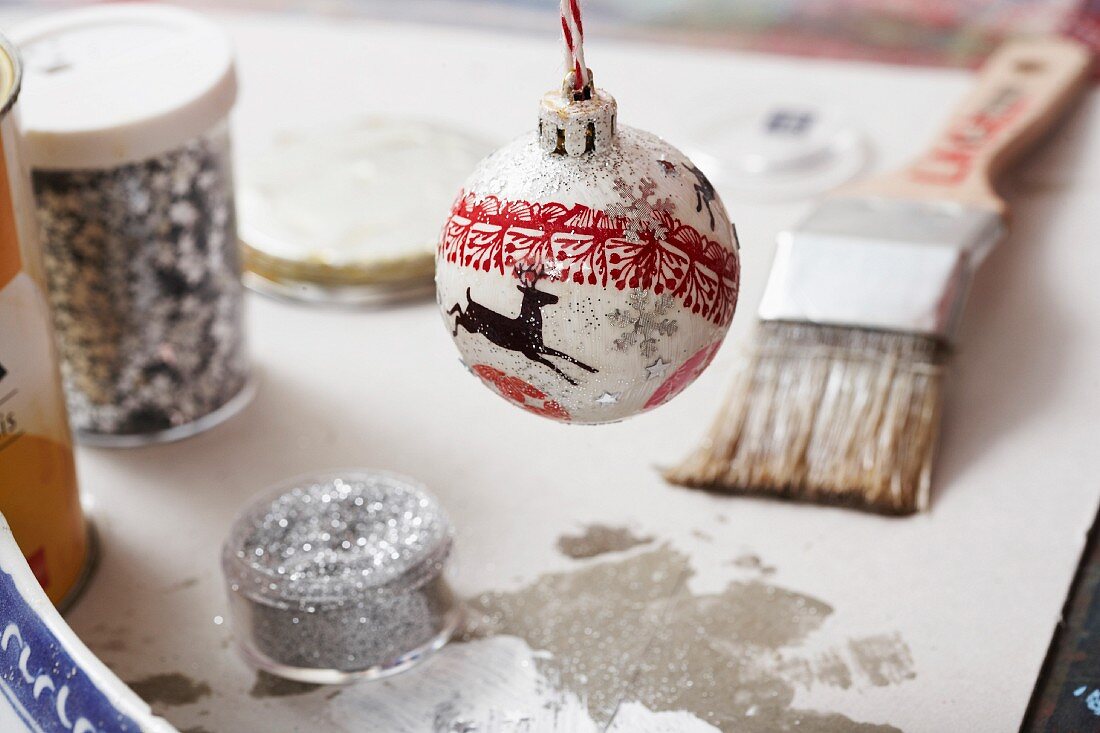 Christmas bauble with glitter and deer motif