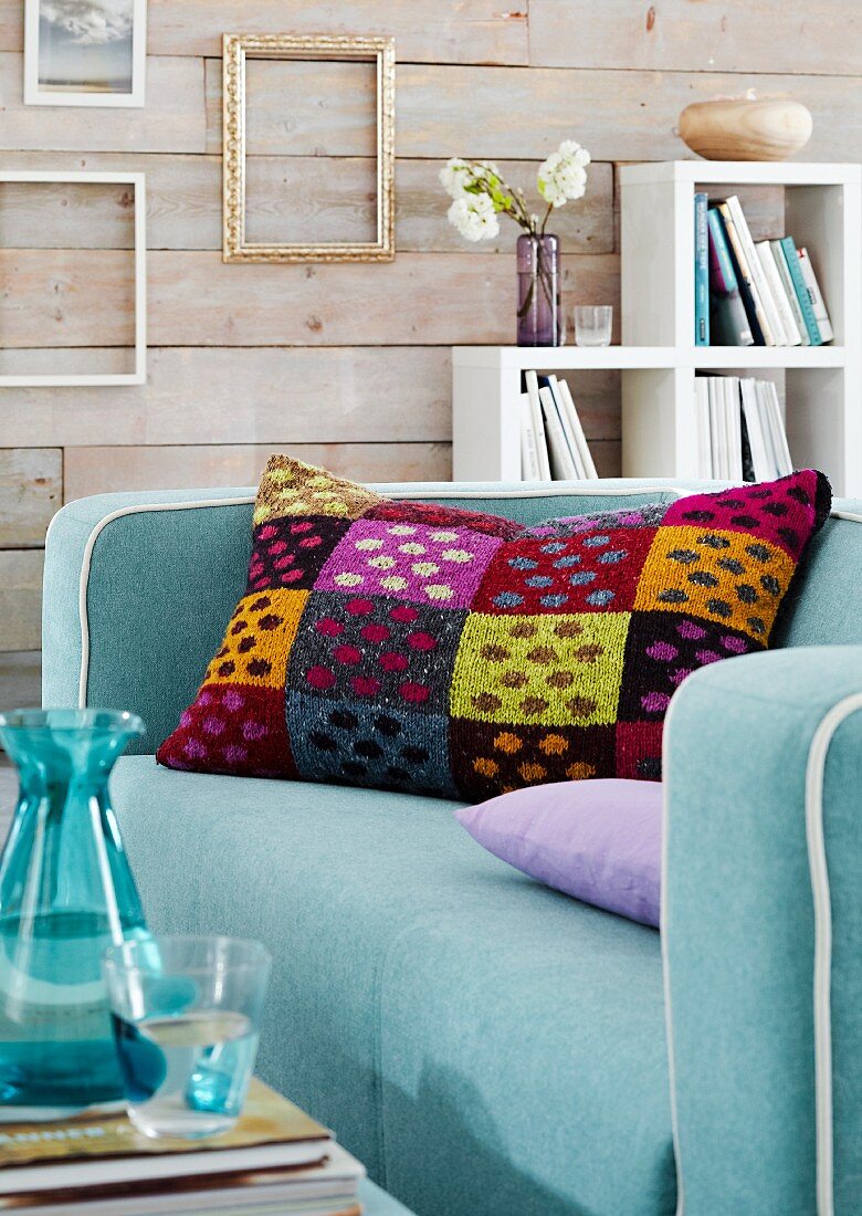 Colourful tweed scatter cushion on sofa in living room