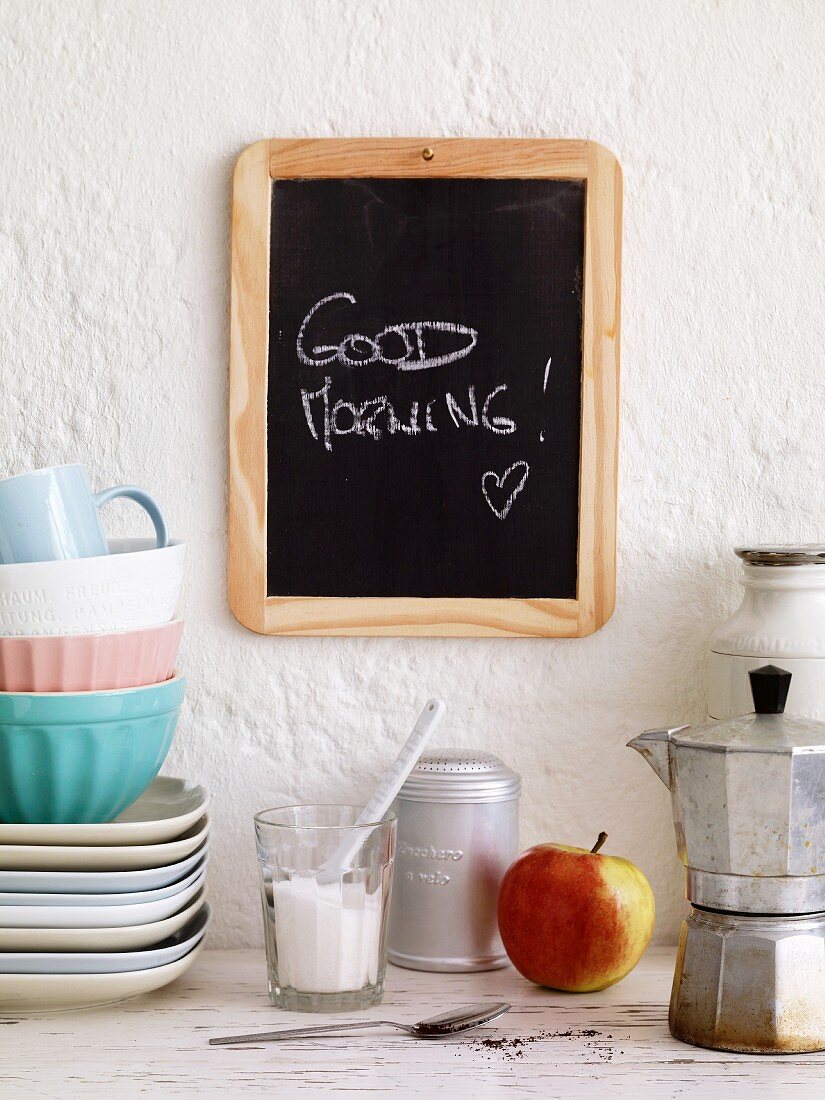 The phrase 'Good Morning' written on a blackboard in a student kitchen