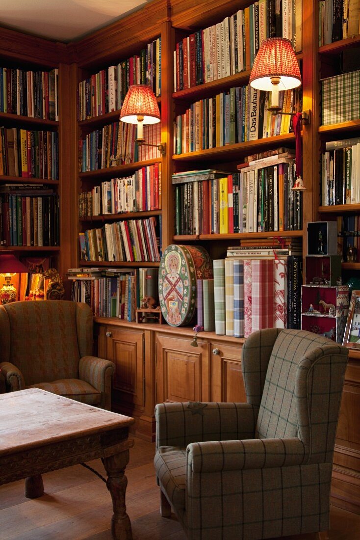 Library with bookcases & wingback armchairs