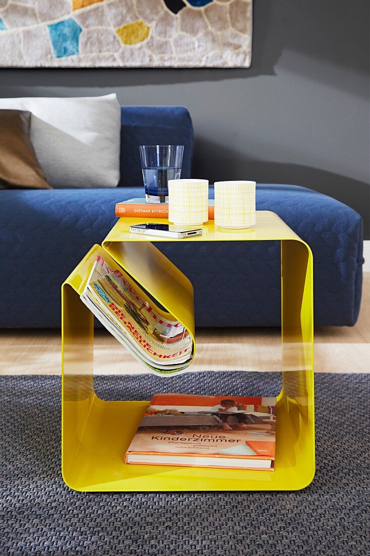 Yellow side table with magazine rack