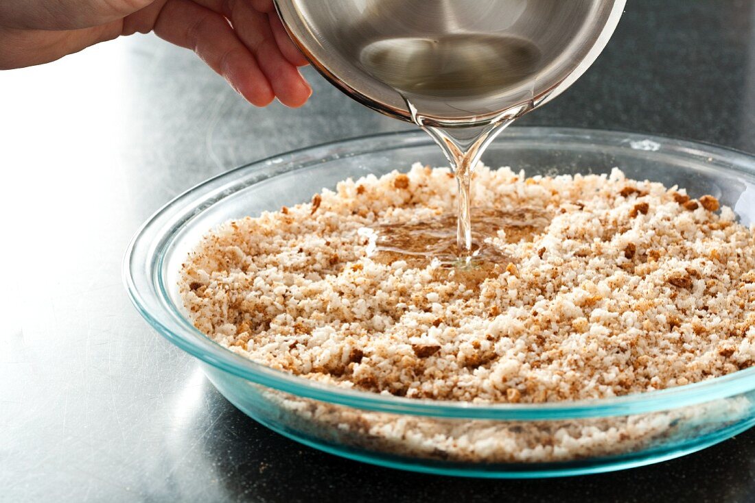 Adding Oil to Bread Crumbs