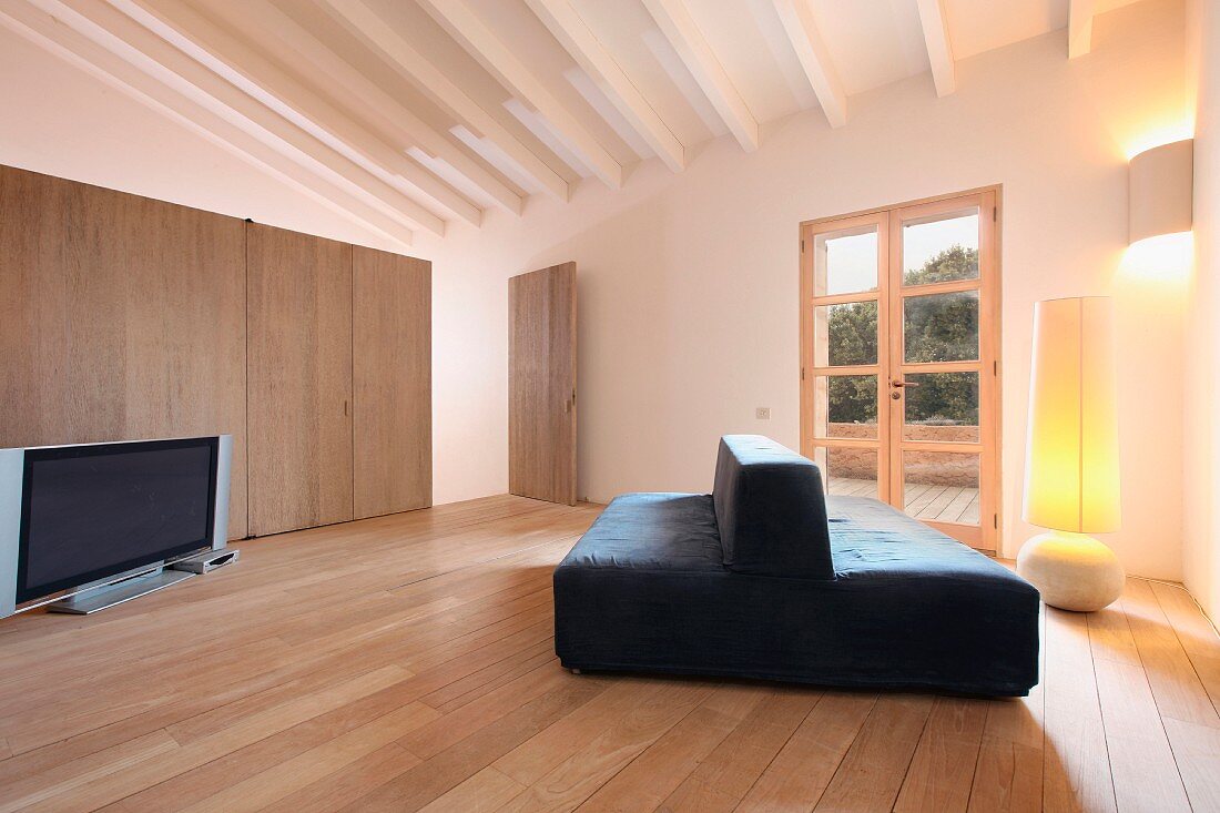 Minimalistic living room with hardwood floors