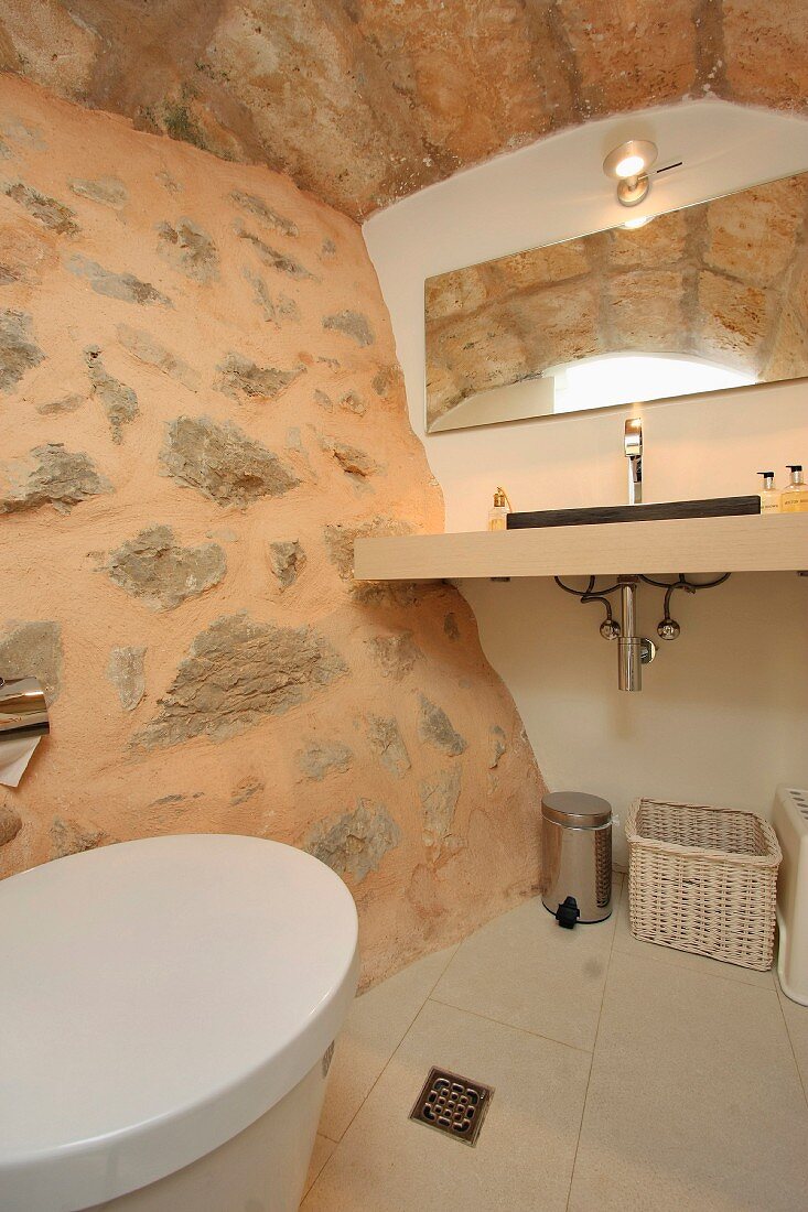 Bathroom with stone wall