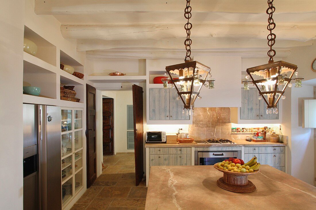 Modern pendant lights above island in kitchen