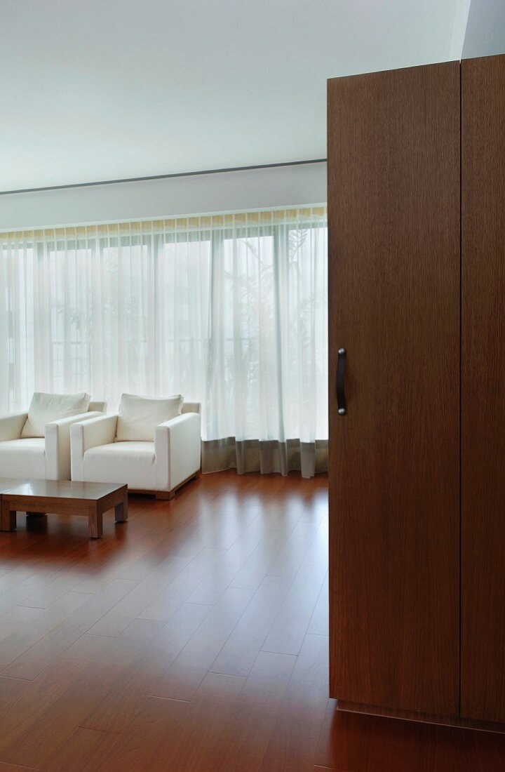 Modern living room with hardwood floors and doors