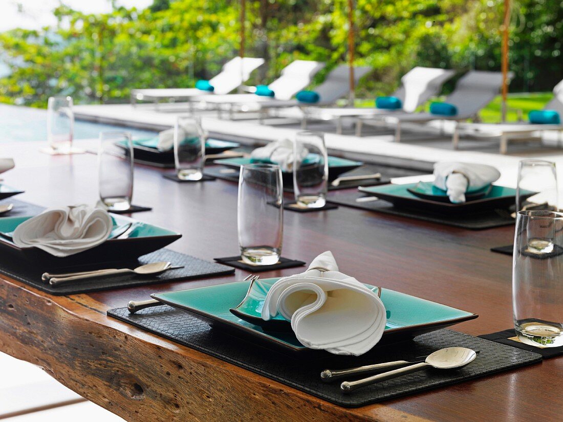 Napkins on place settings on outdoor dining table