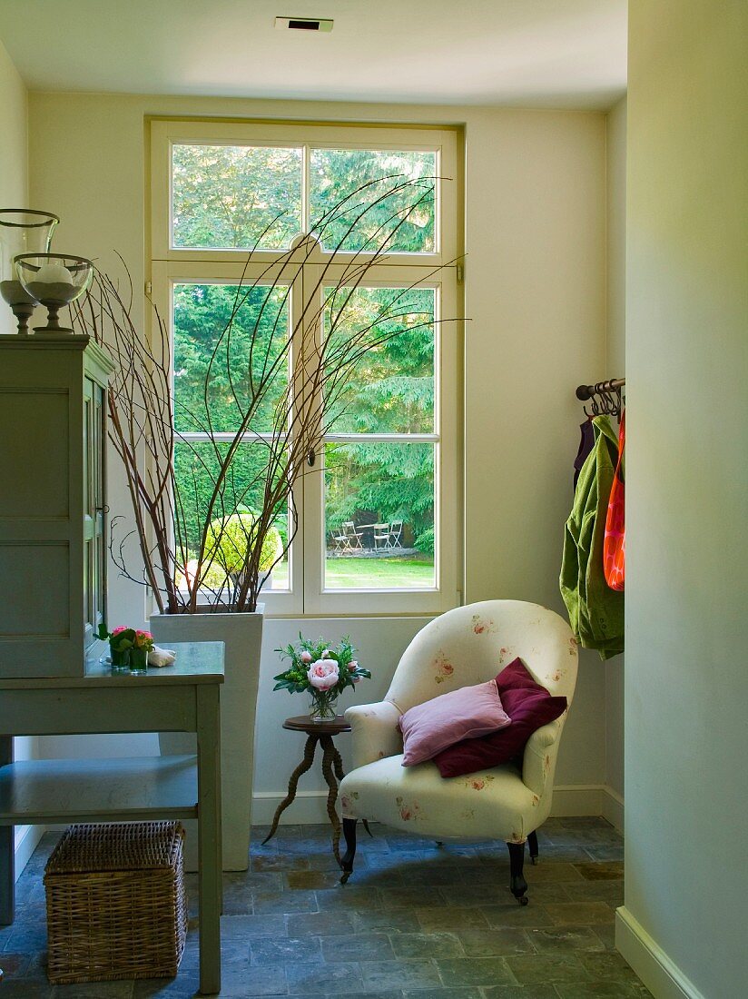 Armchair in corner below window