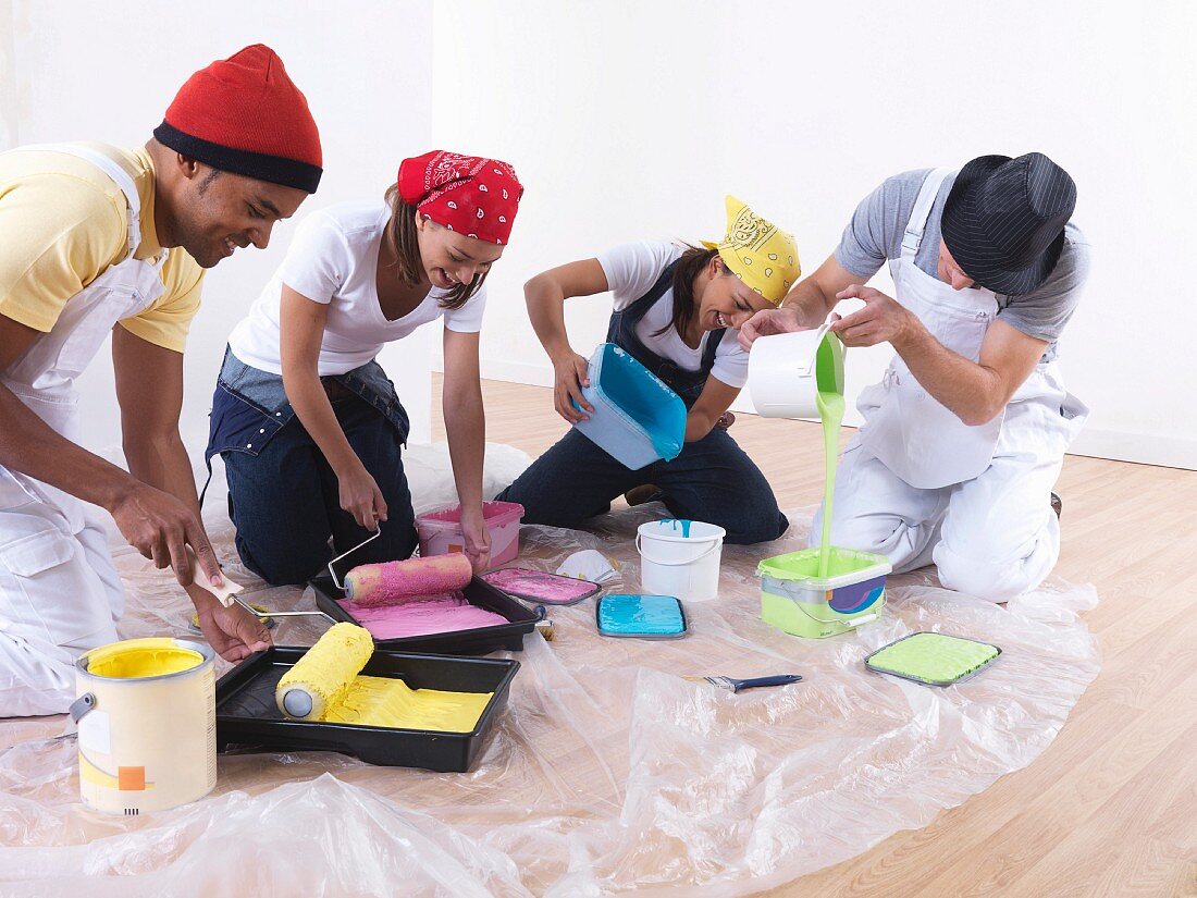 Group of friends pouring paint