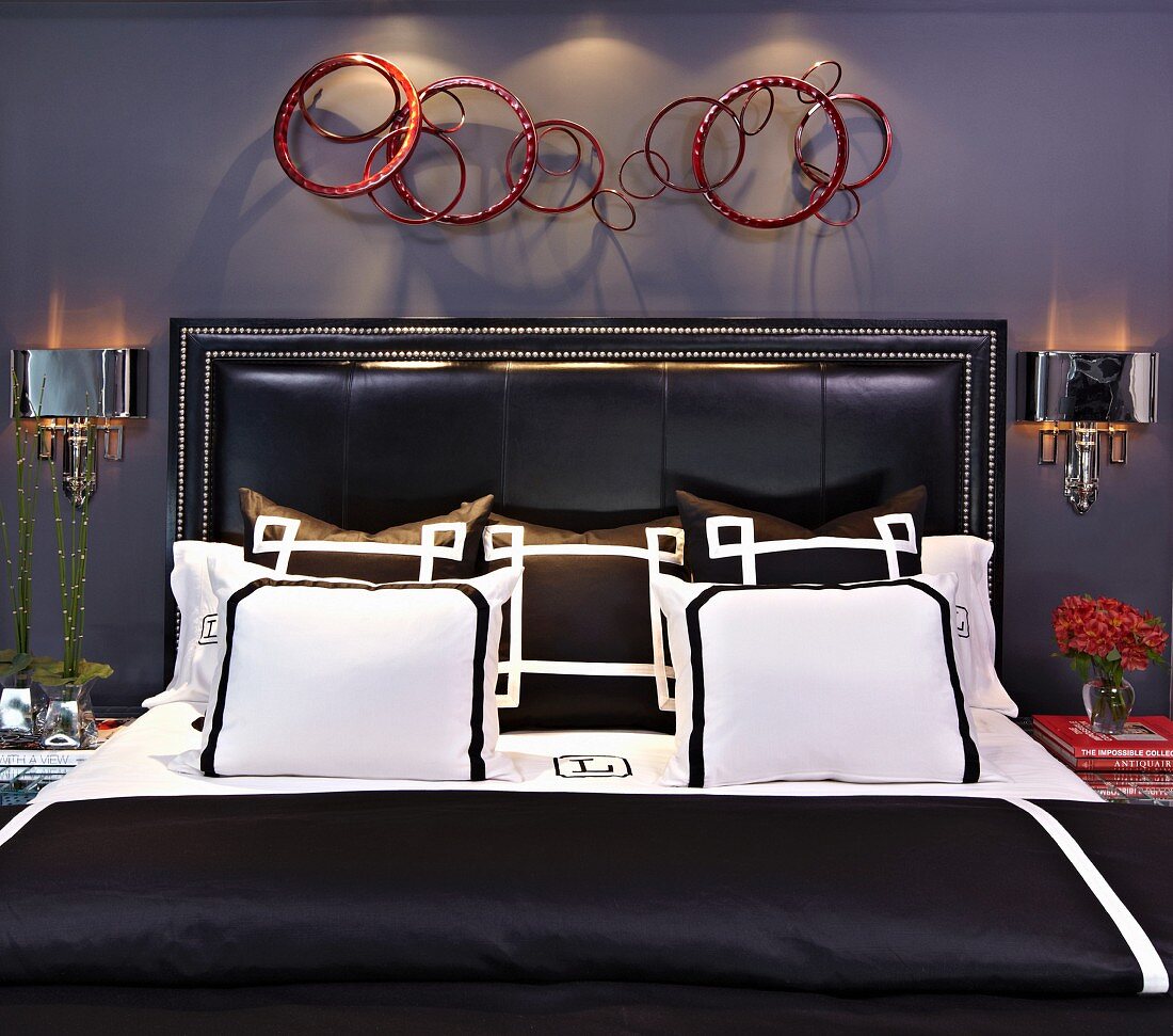 Bed with Black and White Linens in a Bedroom