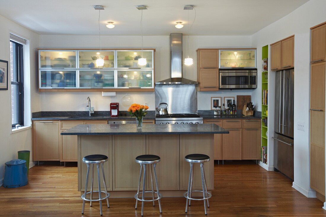 Contemporary Kitchen Interior with Stainless Steel Stools and Appliances